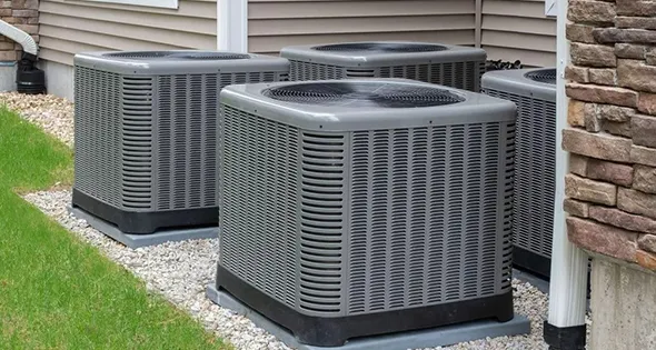 Outdoor HVAC unit with a visible air filter, illustrating the importance of filter upgrades in enhancing system efficiency.