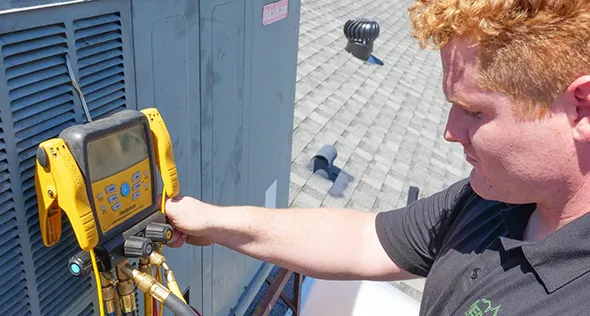 HVAC technician installing a new system in Reno, Nevada.