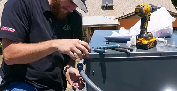 HVAC technician replacing an HVAC system in Carson City, Nevada.